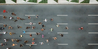Aerial view of marathon city runners. One person leading marathon.